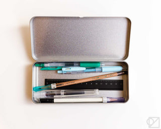 Stainless steel flat pen case open, holding pens and markers, silver with gold trim