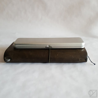 Dark brown flat pen case with hinged lid and small metal clasp