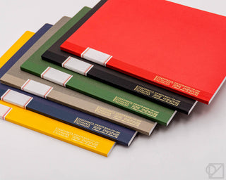 STÁLOGY 016 B5 notebooks in red, yellow, blue, gray, black, and green