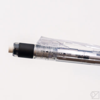 Close-up of blue mechanical pencil barrel with ON/LEAD LOCK OFF switch
