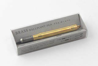 Brass ballpoint pen in packaging box with gray-tipped insert