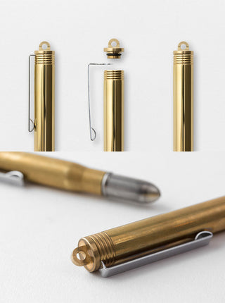 Brass fountain pen set with capped barrels and one pen uncapped