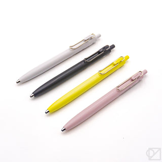 Uni-Ball One F 0.38mm gel pens, white, black, yellow, and mauve barrels