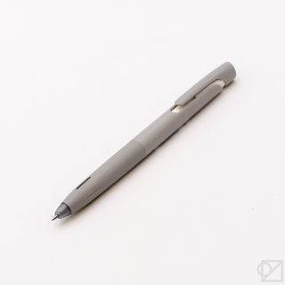 0.5 mm gel pen, light gray barrel with pointed tip and side clip